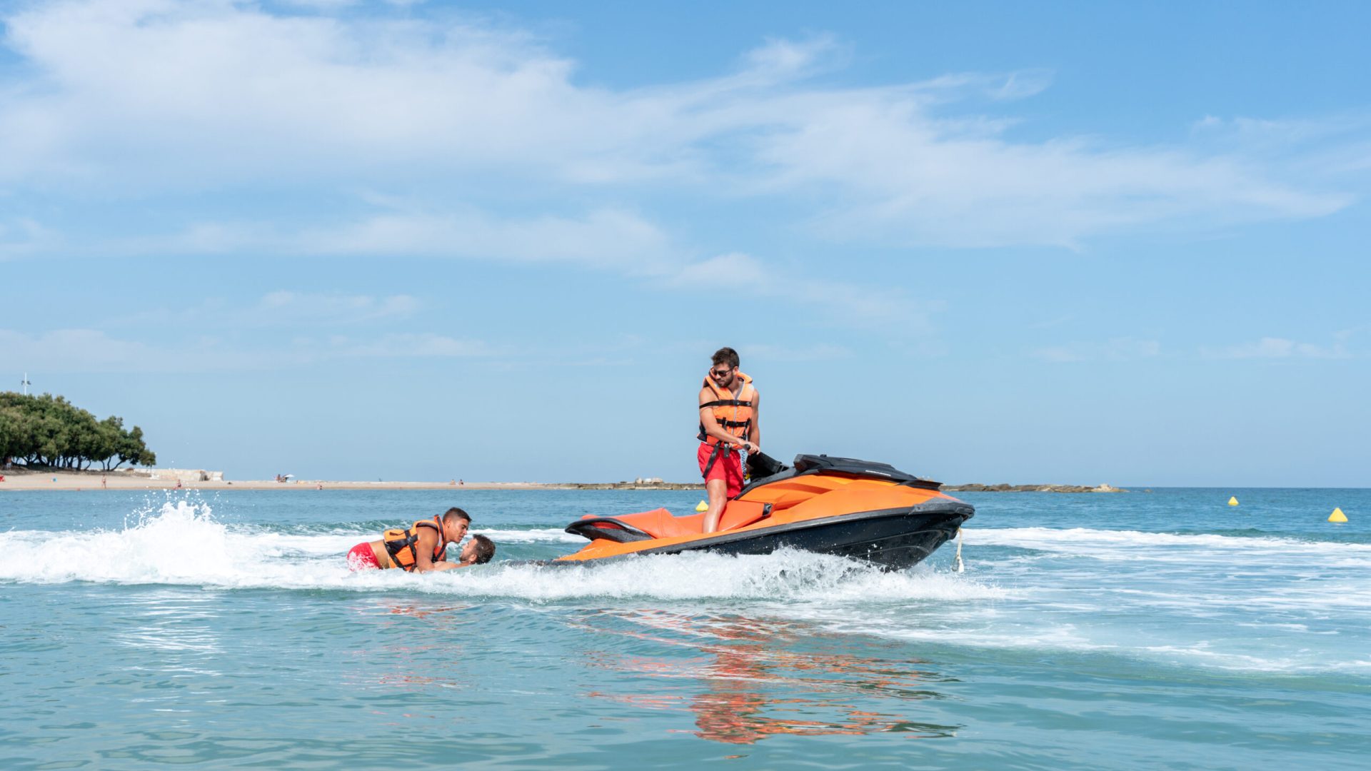 Profile photo of a Lifeguard driving a Jet ski on duty on the sea